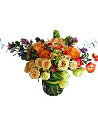 Luxury spring flower arrangement with ranunculus, garden roses, tulips, eucalyptus, and waxflower in a lush market-style design