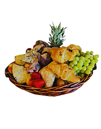 Large gift basket with seasonal fruit, pastries, chocolates, fresh flowers and greenery