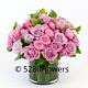 Elegant bouquet of two to four dozen fresh lavender and purple roses, beautifully arranged and displayed in a classic vase