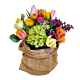 Denver Spring tulips and ranunculus in burlap vase